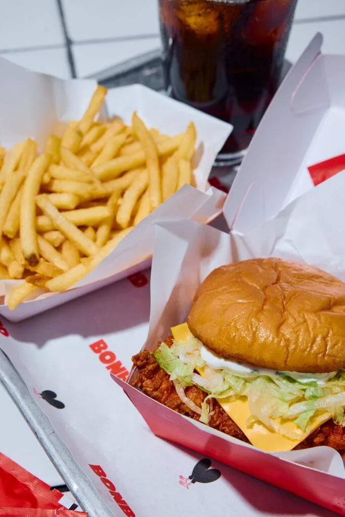 A Bonbird chicken burger with fries and a drink
